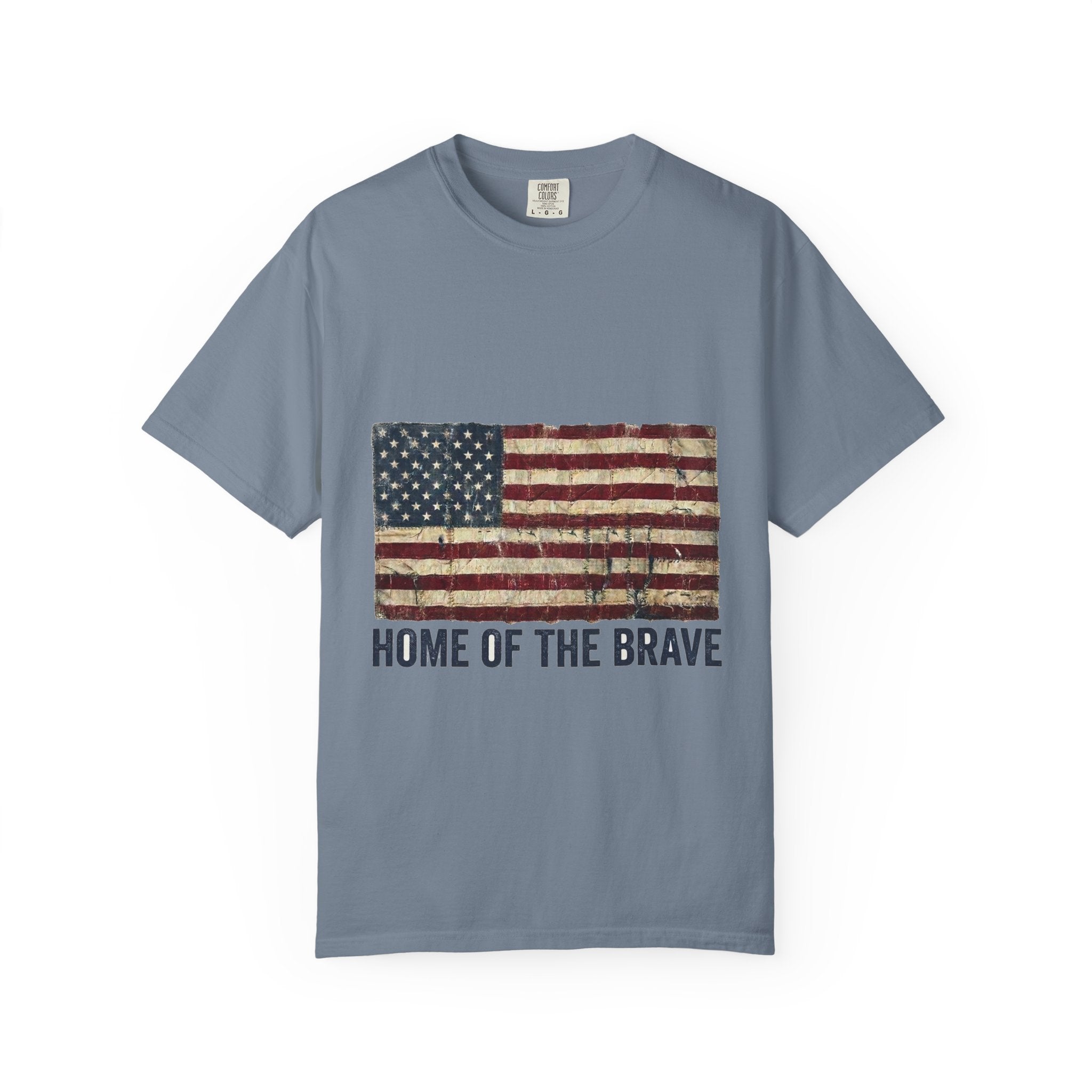Blue Jean garment-dyed Comfort Colors tee with a distressed tattered US flag and HOME OF THE BRAVE lettering
