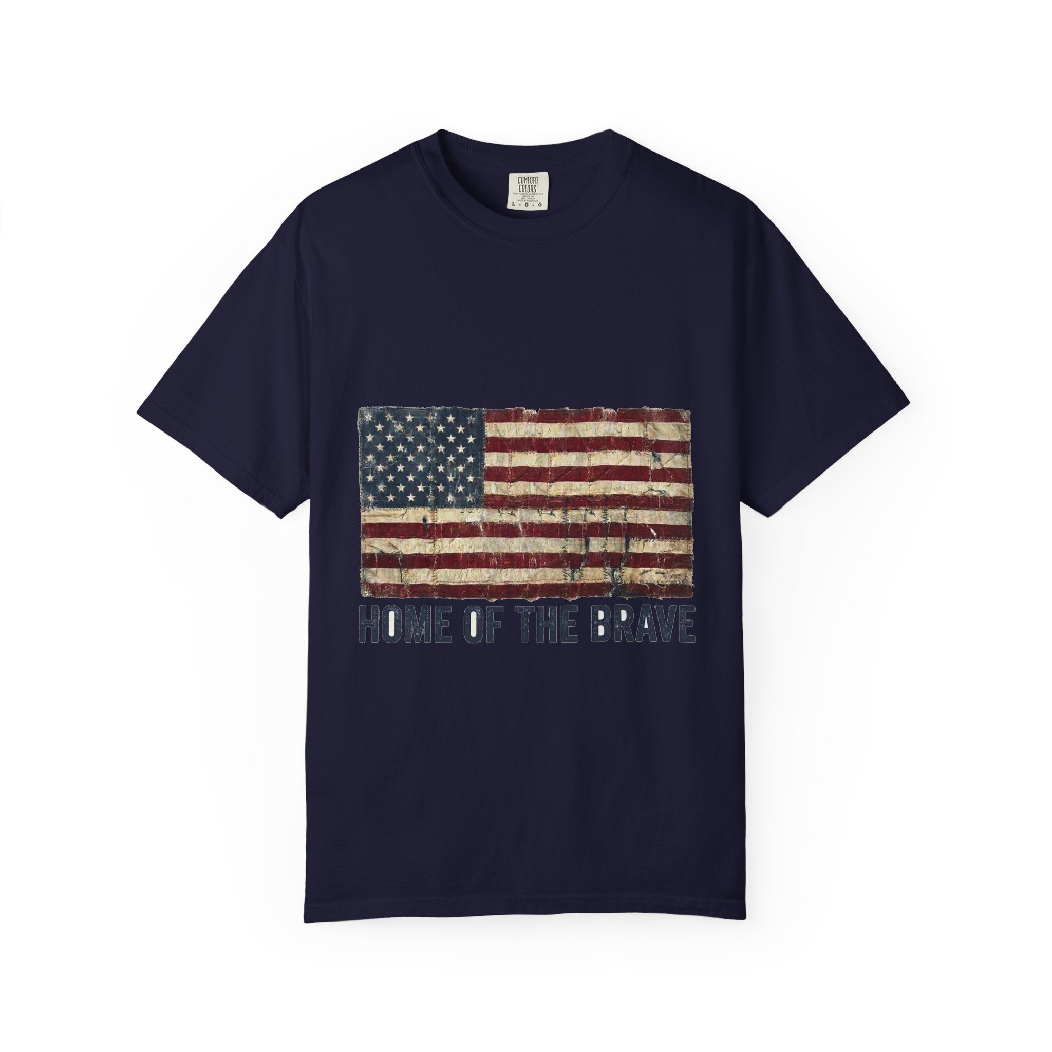 True Navy garment-dyed Comfort Colors tee with a distressed tattered US flag and HOME OF THE BRAVE lettering