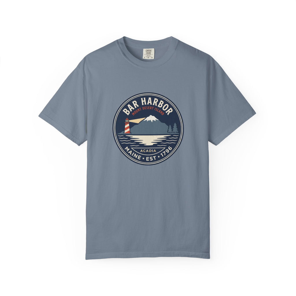 Bar Harbor Maine tee in Blue Jean, Acadia vintage badge with lighthouse, Cadillac Mountain and evergreens in a navy roundel, EST. 1796