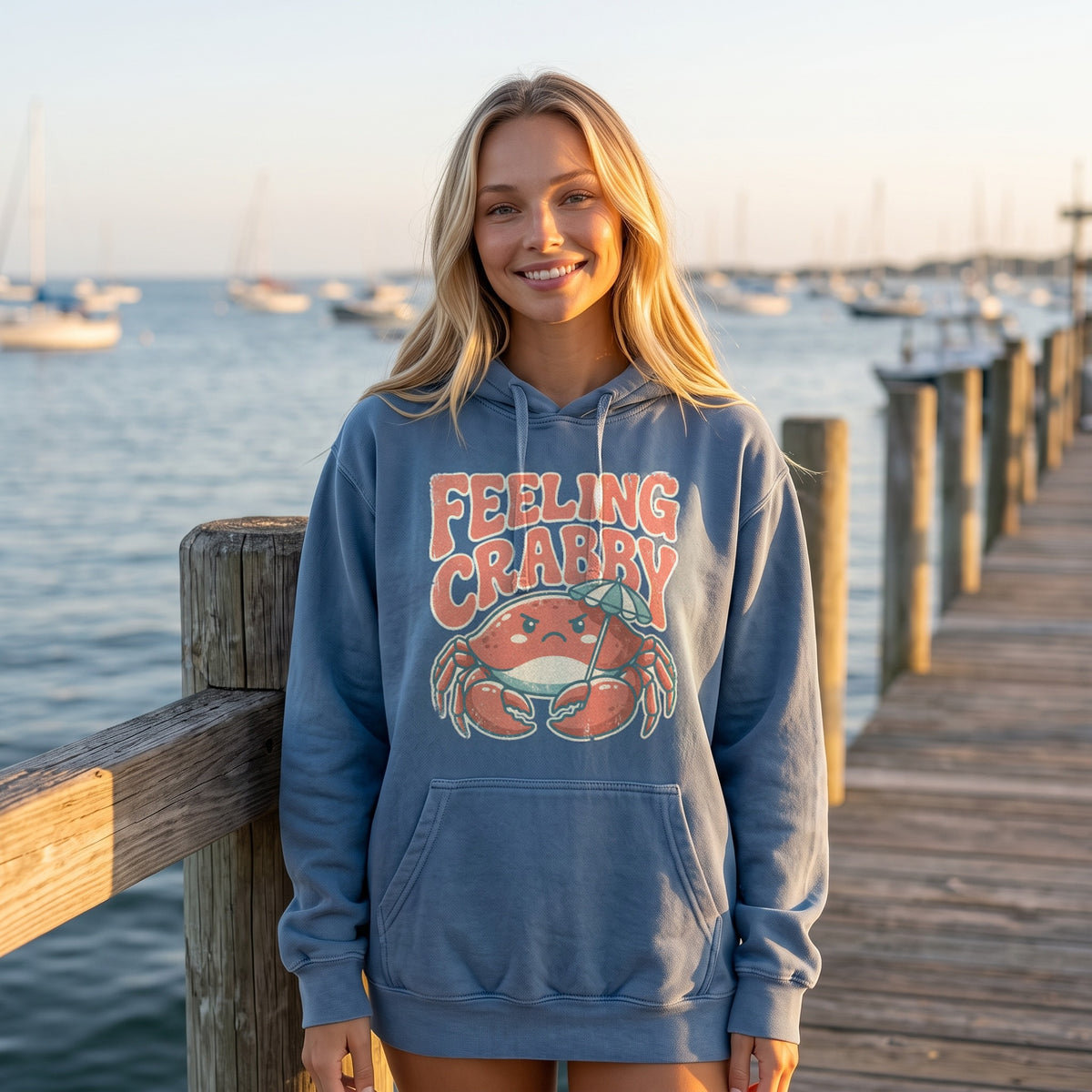 Feeling Crabby Hoodie in blue jean, worn by an approved model, wide lifestyle photograph