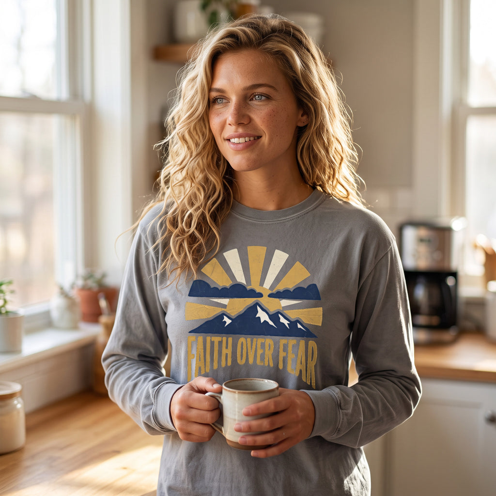 Faith Over Fear long sleeve tee in grey, worn by an approved model, wide lifestyle photograph