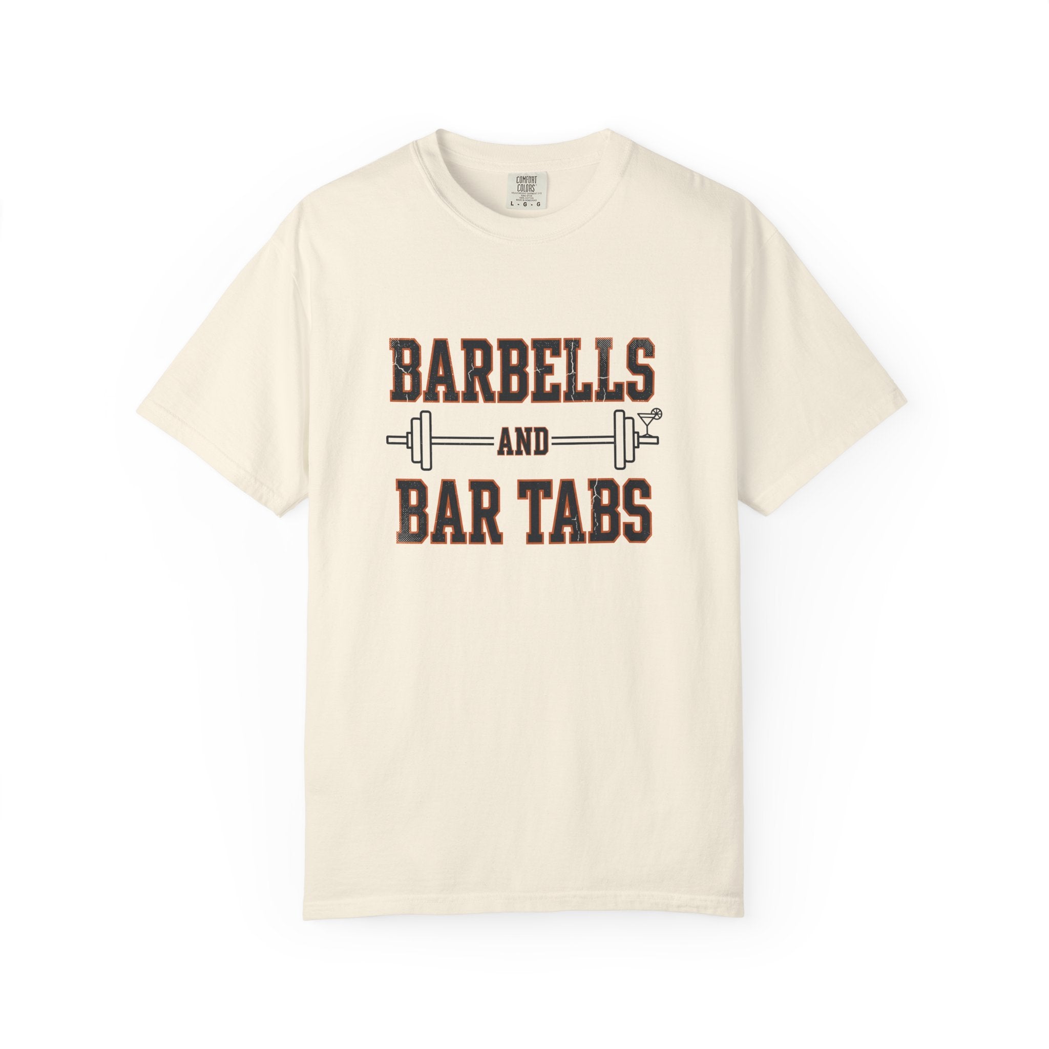 Ivory garment dyed Comfort Colors tee with the Barbells And Bar Tabs barbell and cocktail glass design