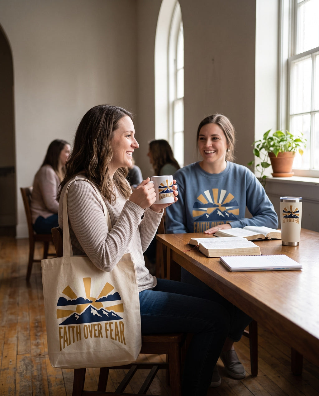 Faith Over Fear mug, crewneck, tote and tumbler in a hall after a study group