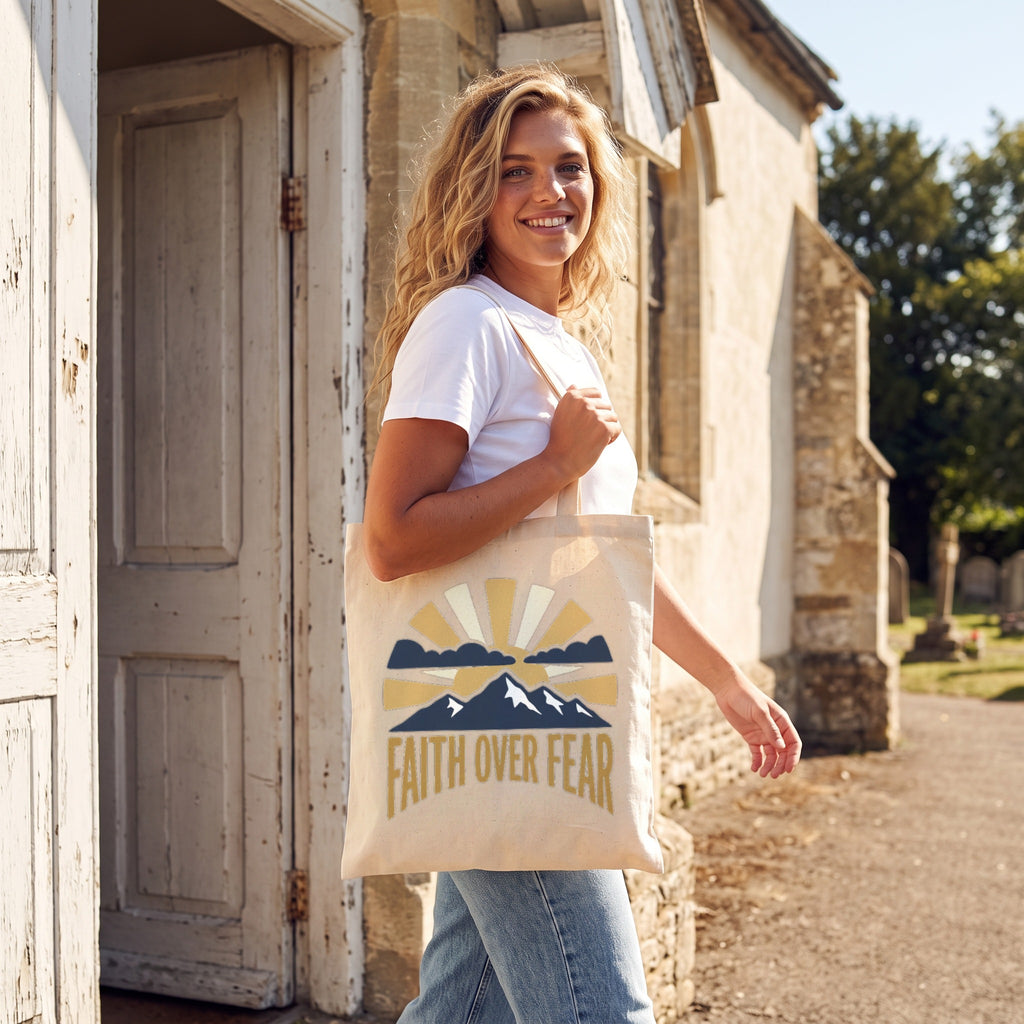 Faith Over Fear Tote Bag in natural, worn by an approved model, mid lifestyle photograph