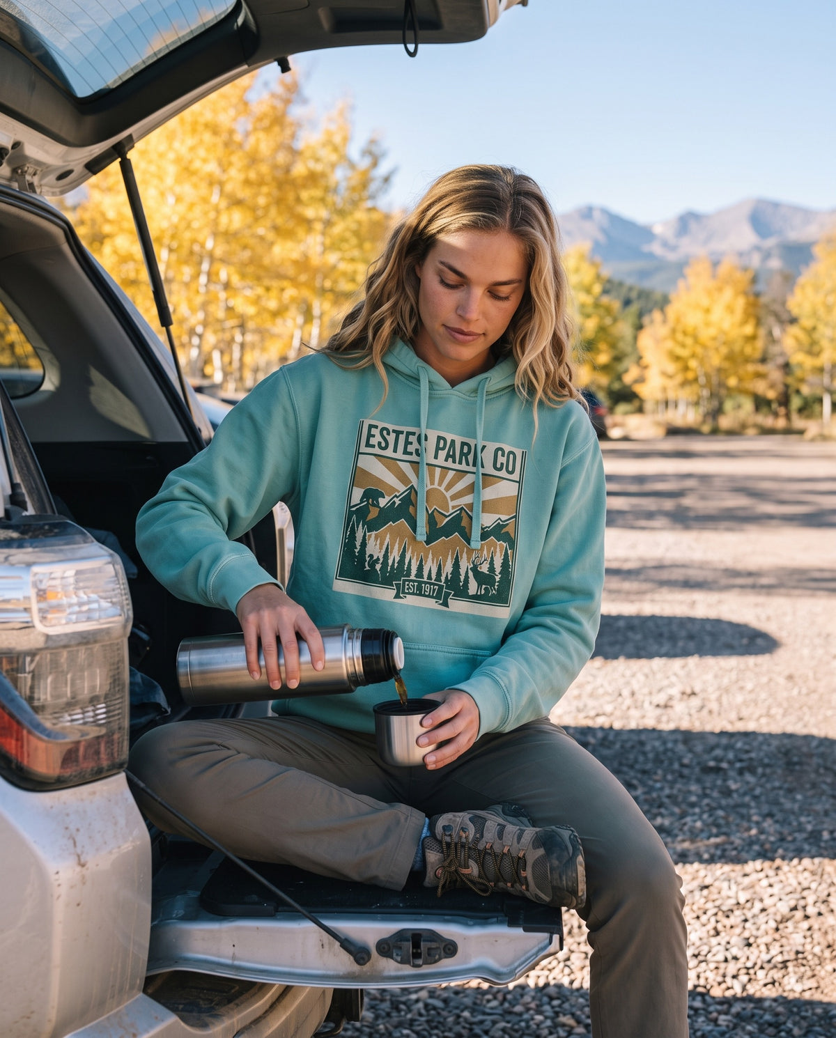 Estes Park hidden wildlife hoodie worn at a mountain meadow fence line at golden hour, print shown in full