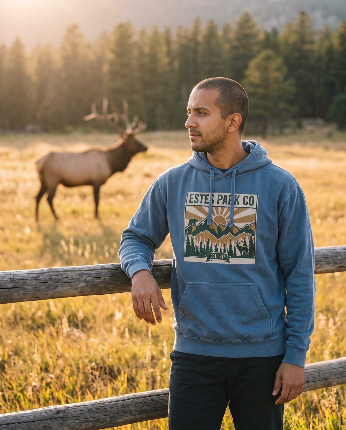Estes Park hidden wildlife hoodie worn on a tailgate pouring coffee under fall aspens