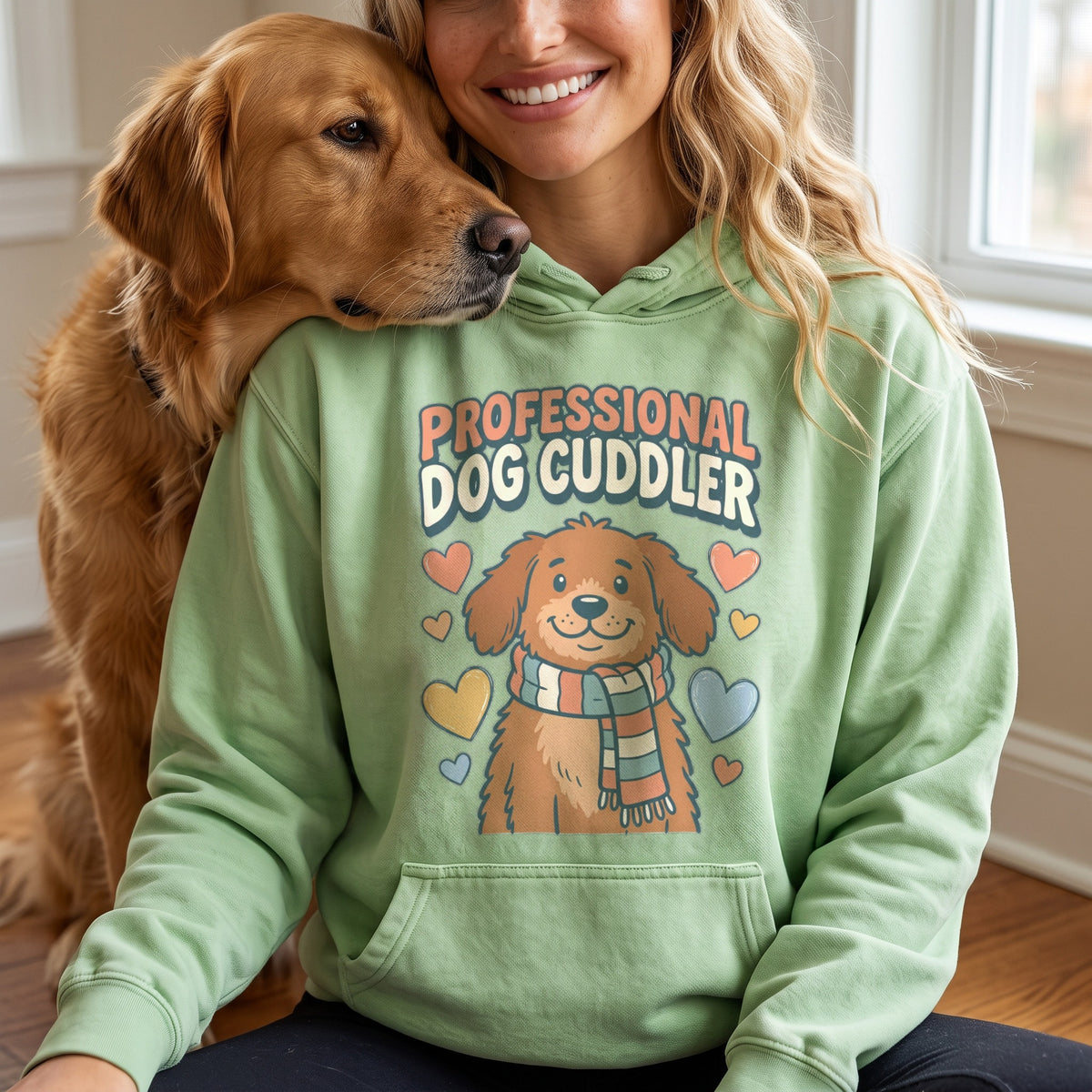 Professional Dog Cuddler Hoodie in light green, worn by an approved model, close lifestyle photograph