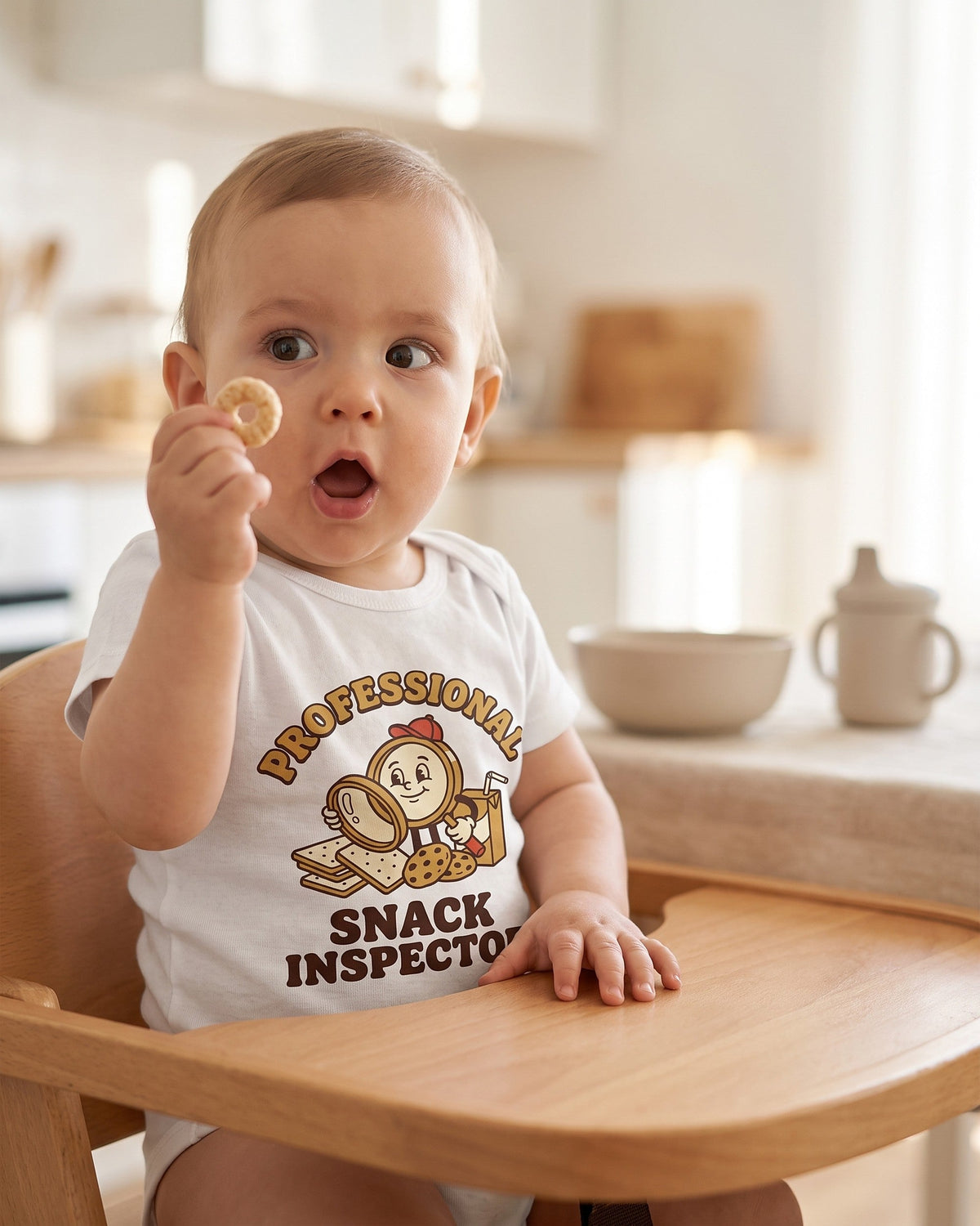 Professional Snack Inspector retro mascot design on a white baby bodysuit worn by a happy baby