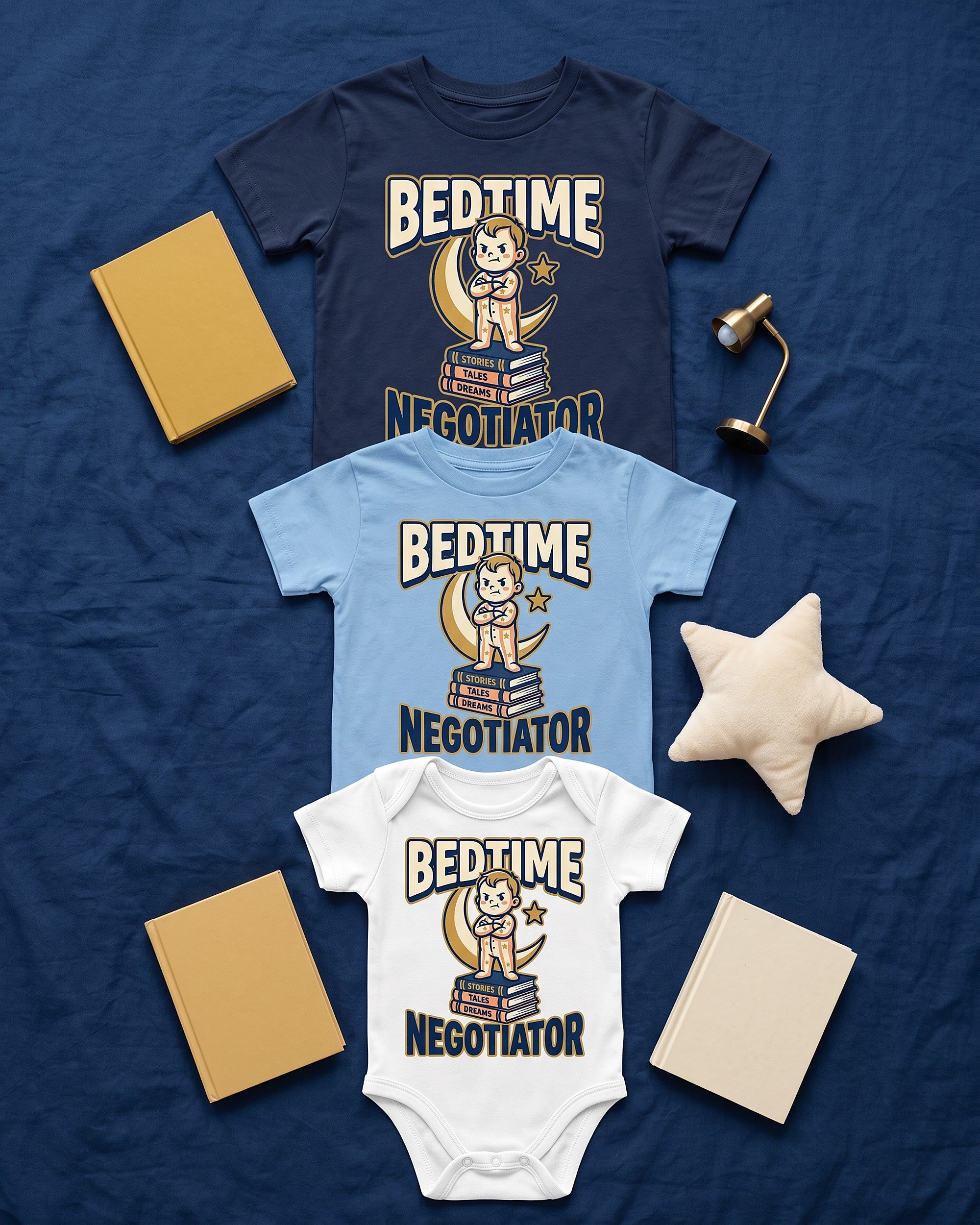 Flat lay of the Bedtime Negotiator design across matching kids garments with playful props