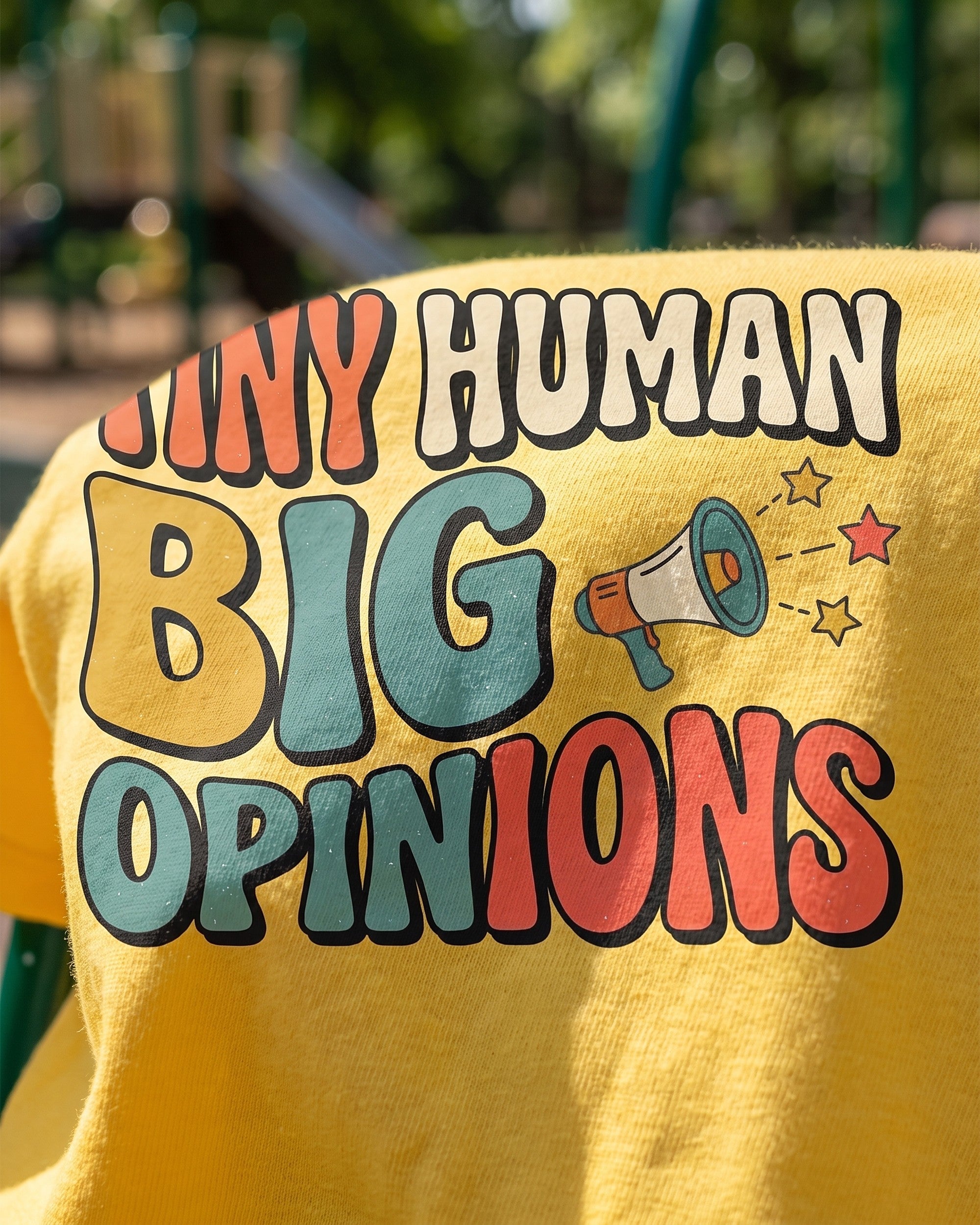 Close up of the Tiny Human Big Opinions print showing soft matte ink on cotton weave