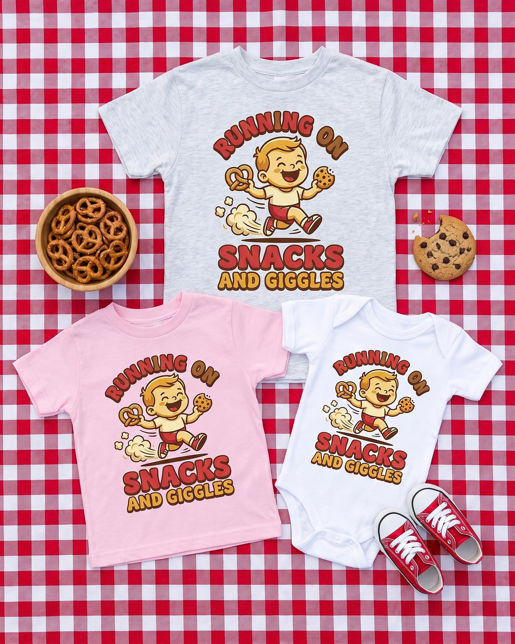 Flat lay of the Running on Snacks and Giggles design across matching kids garments with playful props