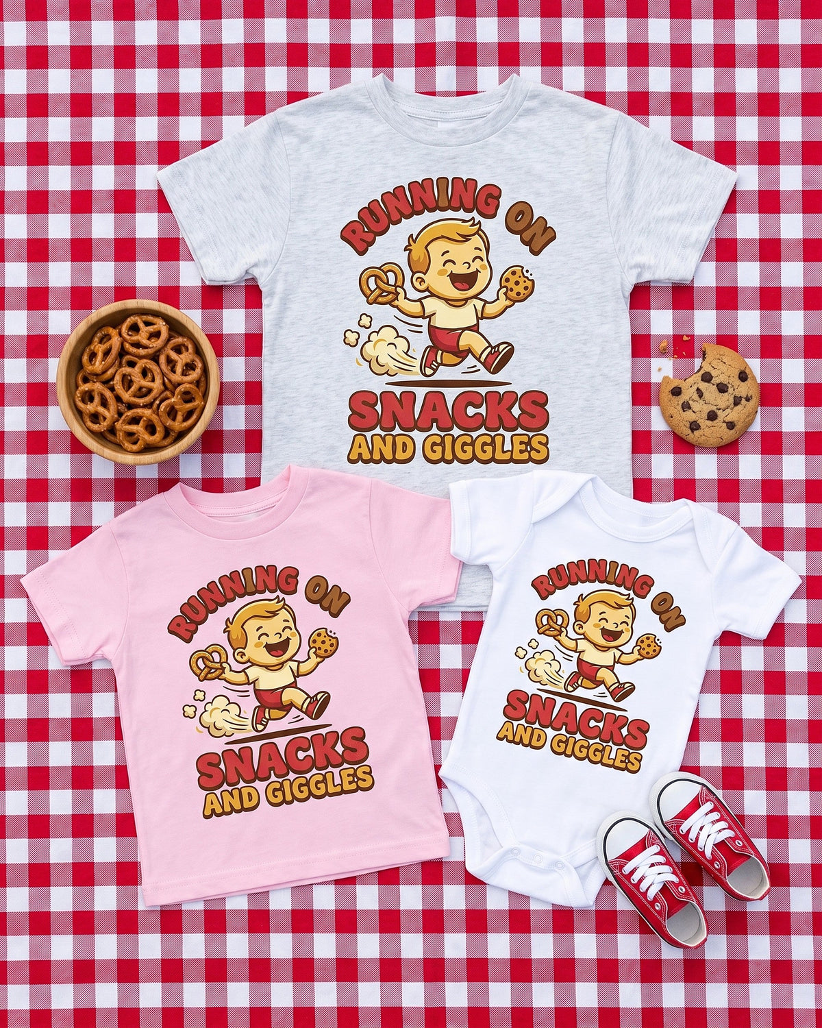 Flat lay of the Running on Snacks and Giggles design across matching kids garments with playful props