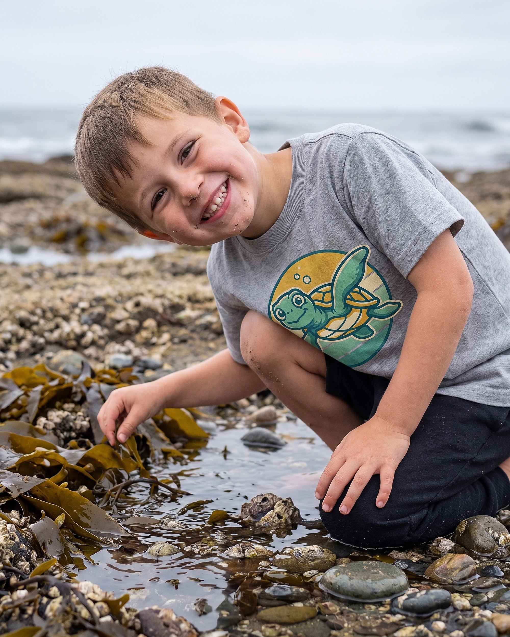 sea turtle sunset badge design on a kids tee, child laughing in a playful scene