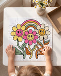 Child completing the groovy daisies rainbow 30 piece kids puzzle at a play table
