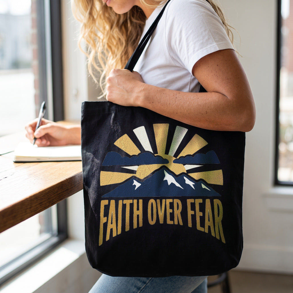 Faith Over Fear Tote Bag in black, worn by an approved model, close lifestyle photograph