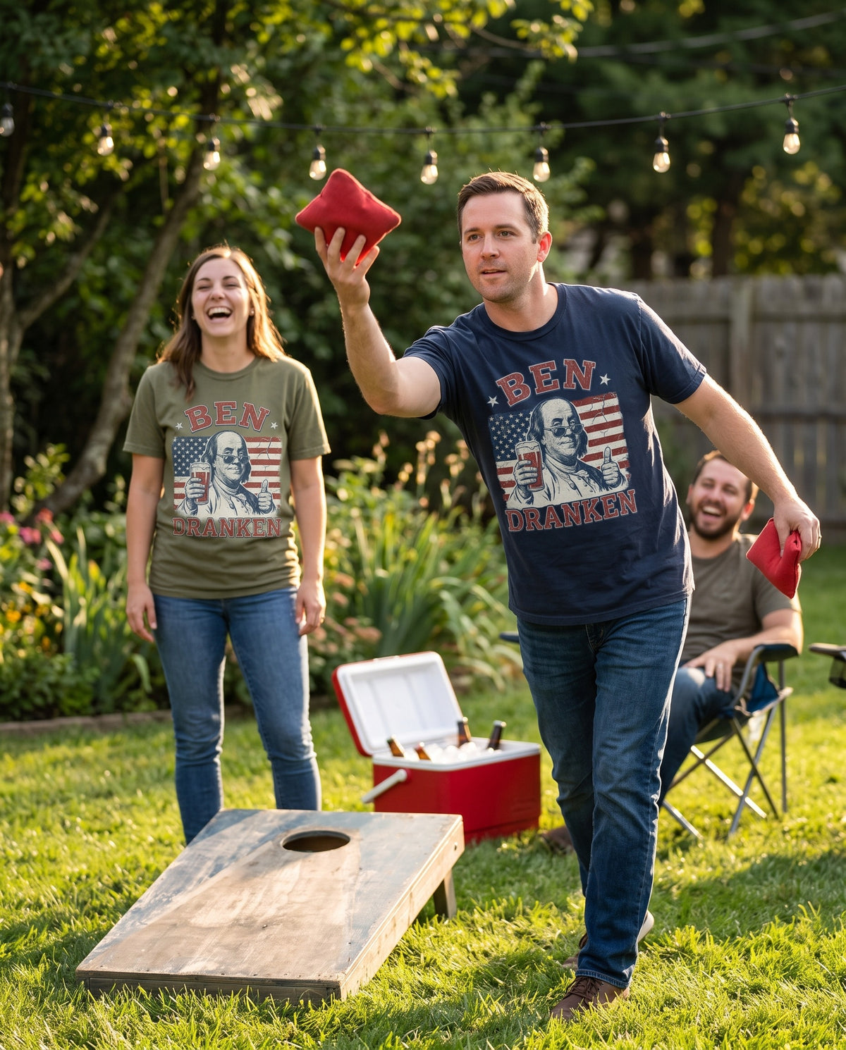 Ben Dranken tee worn at backyard cornhole at golden hour, two colourways in frame