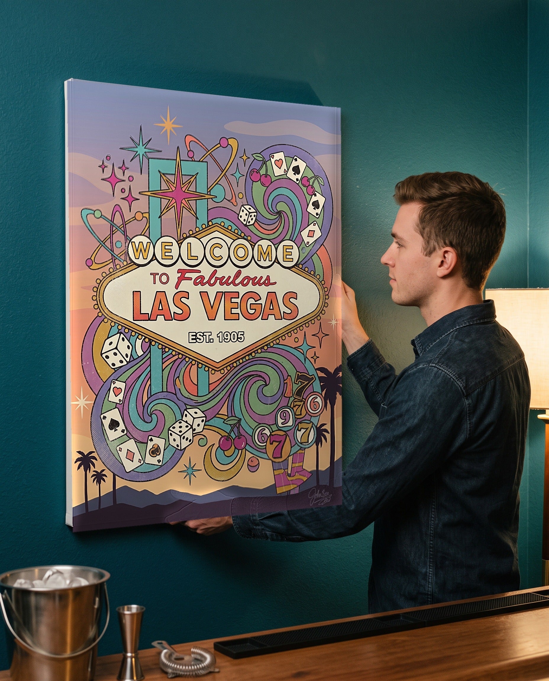 Man leveling the Las Vegas welcome sign canvas, showing its true 18 by 24 inch size