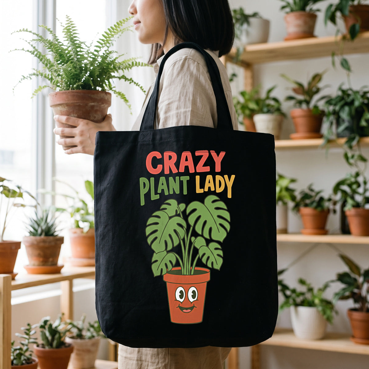 Crazy Plant Lady canvas tote bag in black, carried by an approved model, close lifestyle photograph