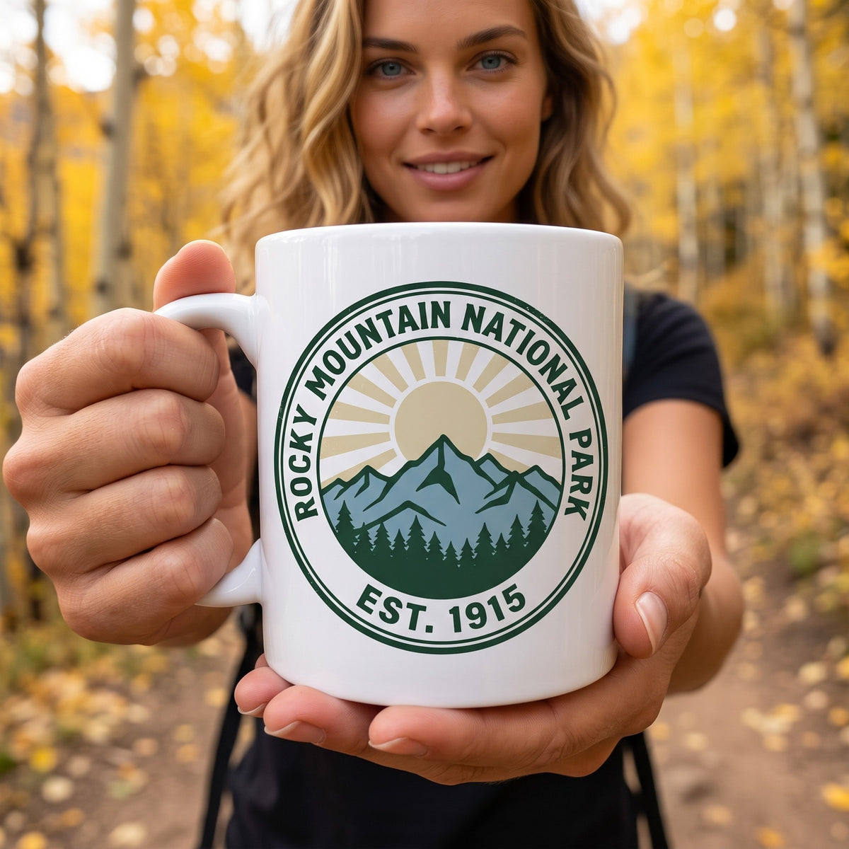 Rocky Mountain National Park 11oz ceramic mug, held by an approved model, close lifestyle photograph