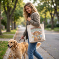 Professional Dog Cuddler Canvas Tote Bag in natural, worn by an approved model, mid lifestyle photograph