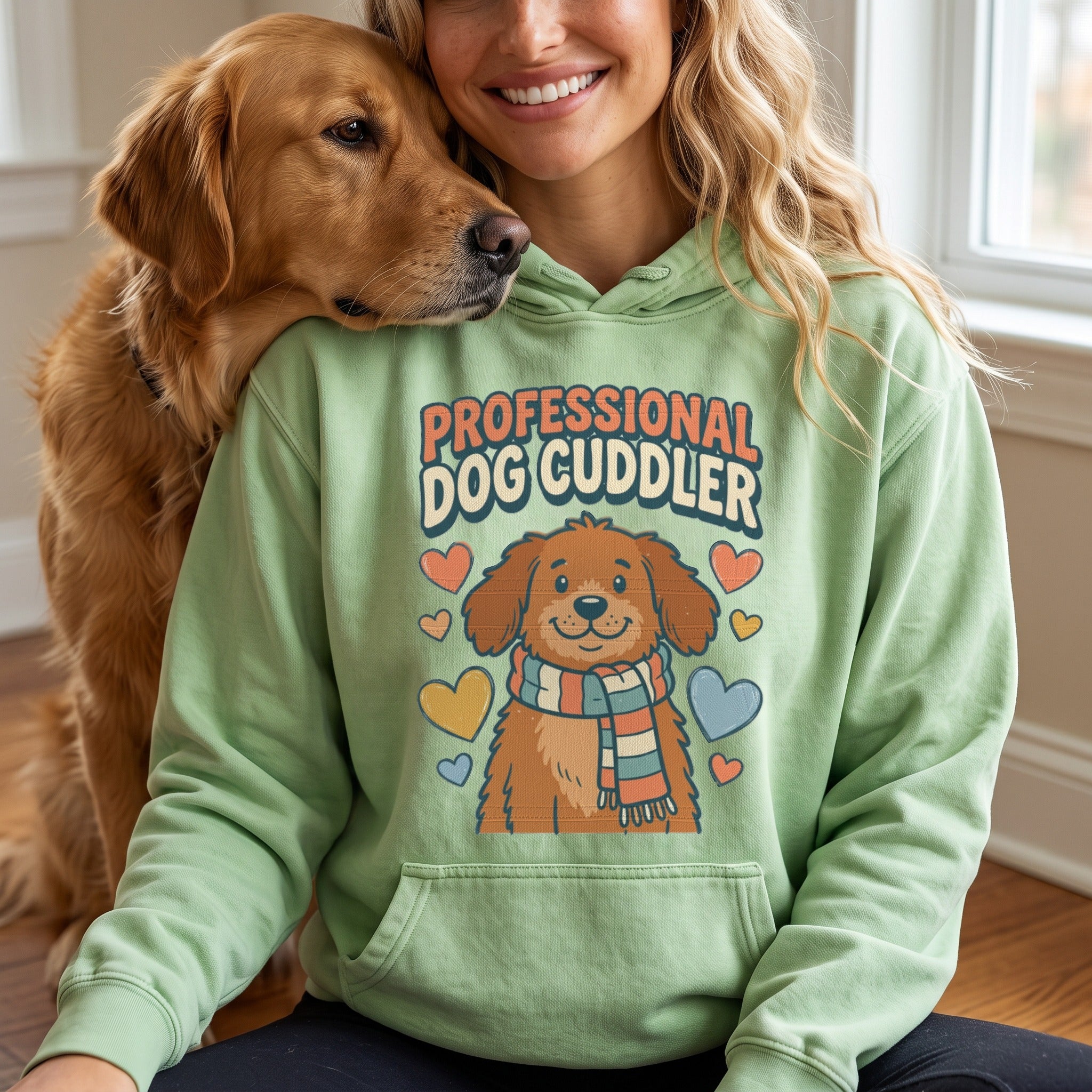 Professional Dog Cuddler hoodie in light green, worn by an approved model, close lifestyle photograph