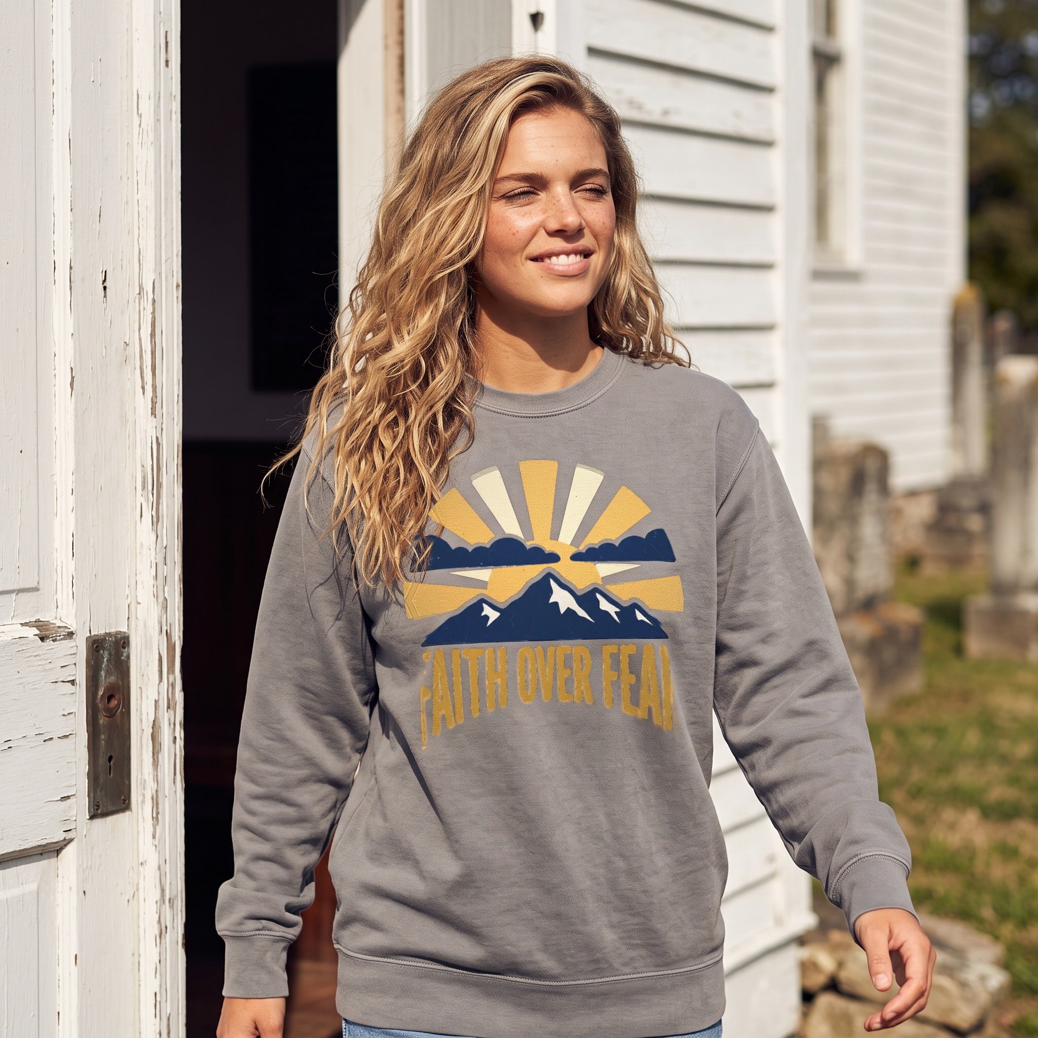 Faith Over Fear crewneck sweatshirt in grey, worn by an approved model, mid lifestyle photograph