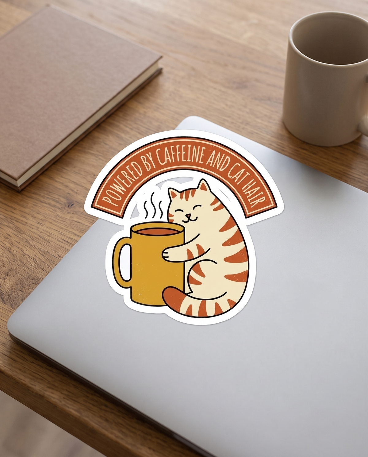 Cat Coffee Powered by Caffeine and Cat Hair kiss cut vinyl sticker on a plain laptop lid, whole design and banner legible