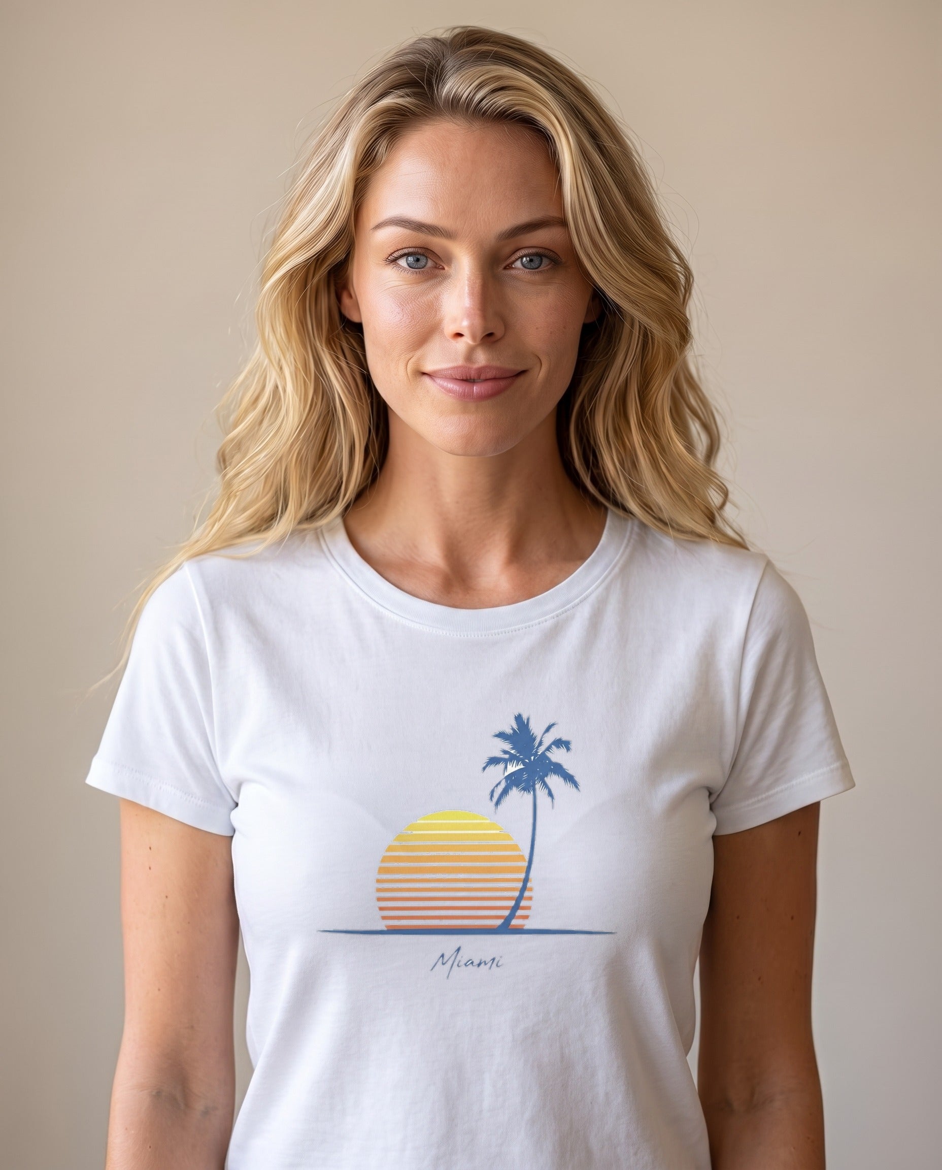Woman wearing the Retro Miami Palm Sunset tee in White, minimalist palm and striped sunset with Miami script
