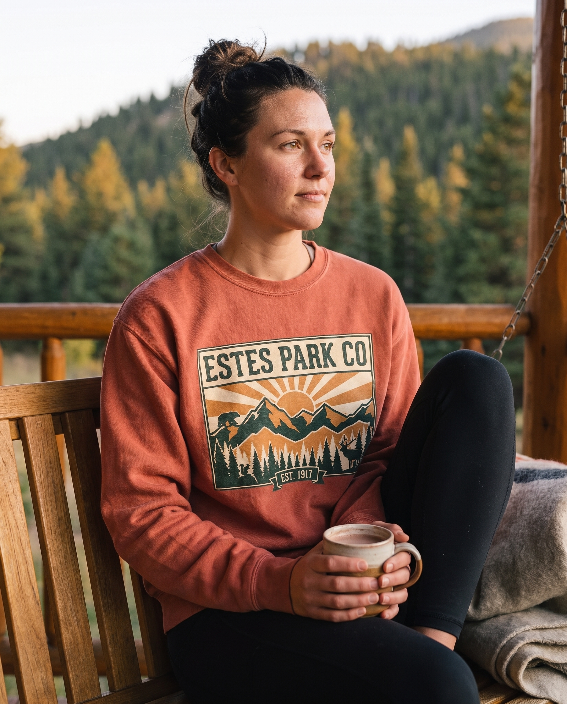 Clay Estes Park CO hidden wildlife crewneck on a lodge porch swing