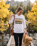 Woman walking her dog across a mountain footbridge near Estes Park Colorado in the white Estes Park CO hidden wildlife long sleeve tee