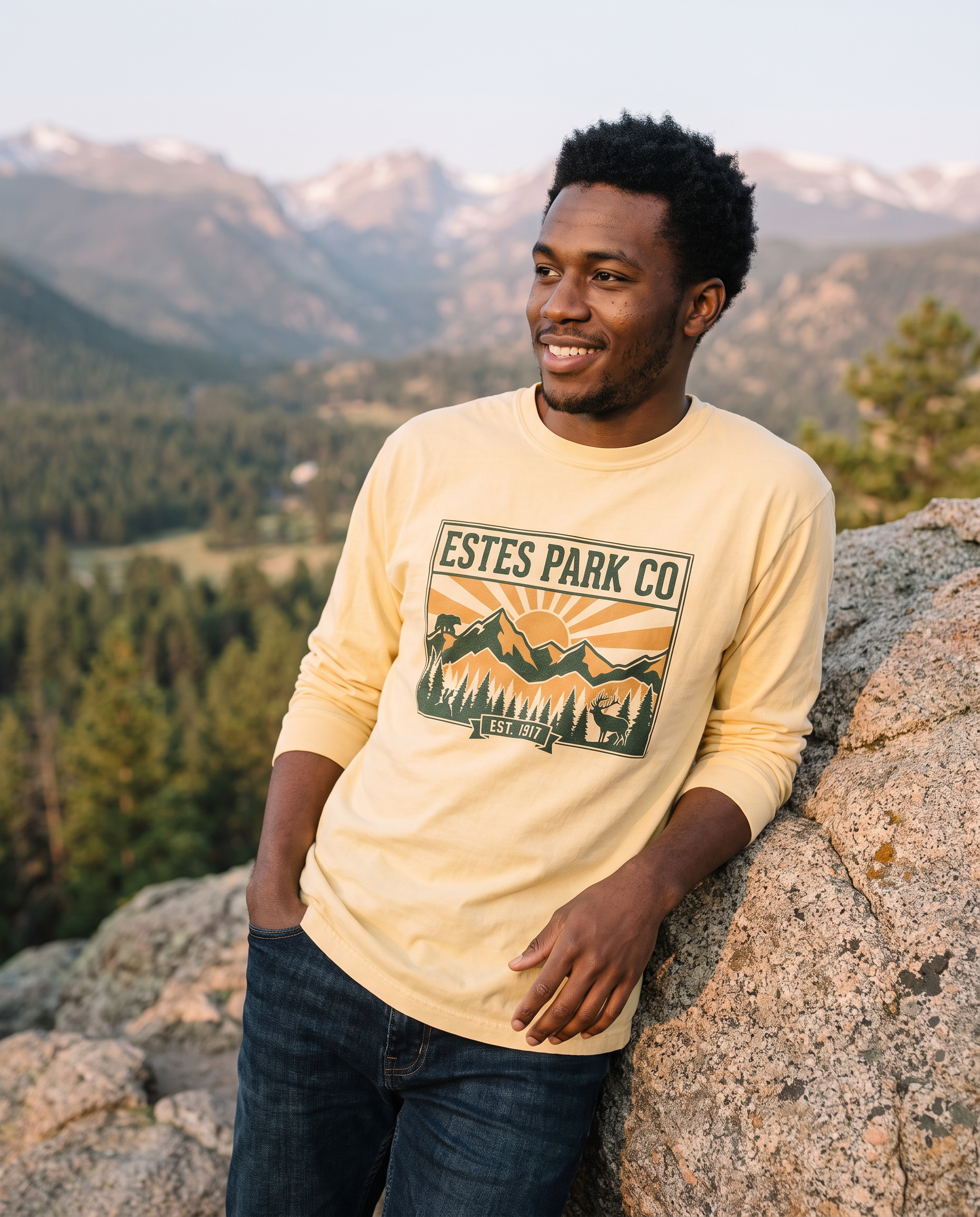 Butter yellow Estes Park CO hidden wildlife long sleeve tee on a man at a Rocky Mountain overlook at sunrise