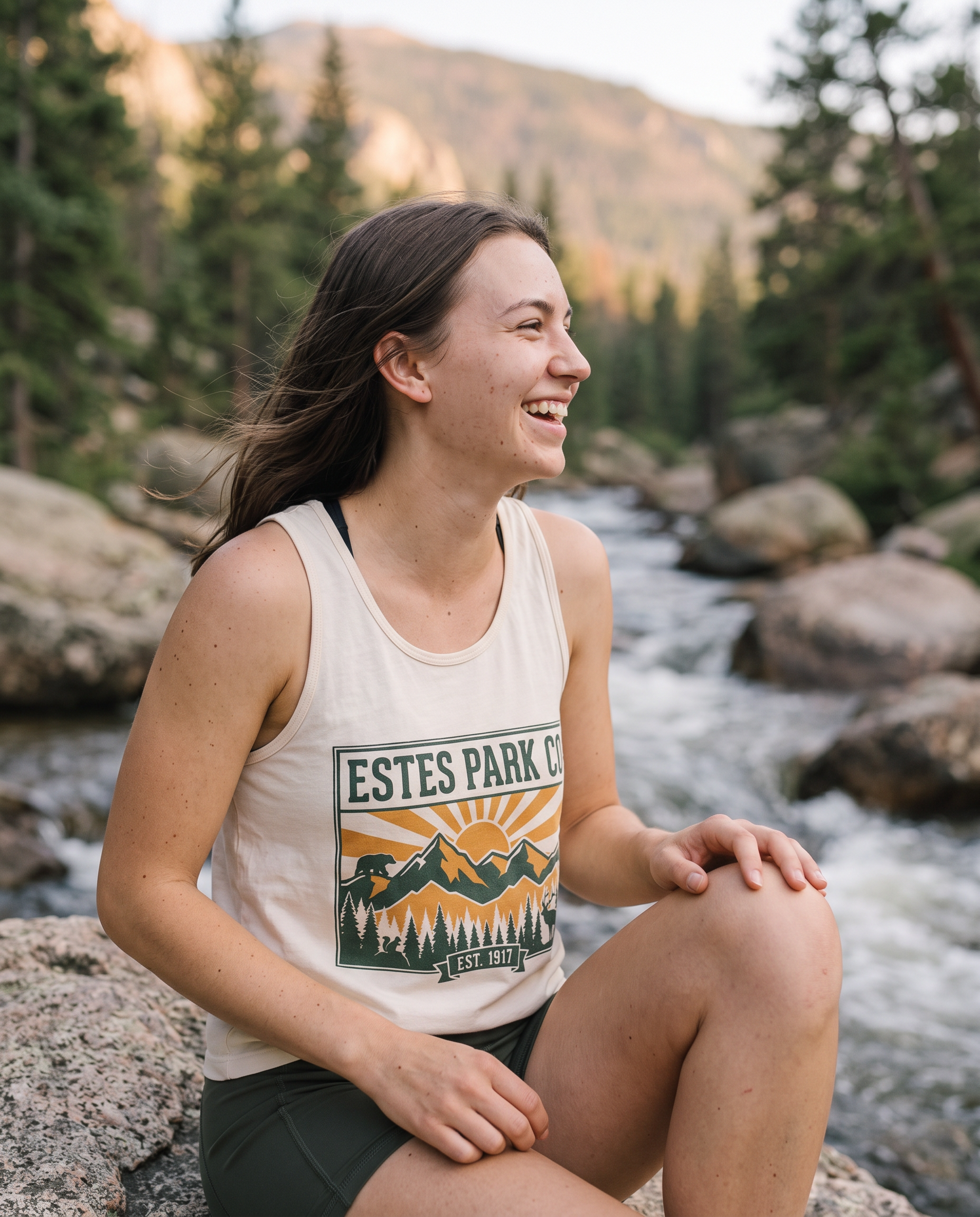 Side angle of the ivory Estes Park CO hidden wildlife tank top worn creekside in Rocky Mountain National Park