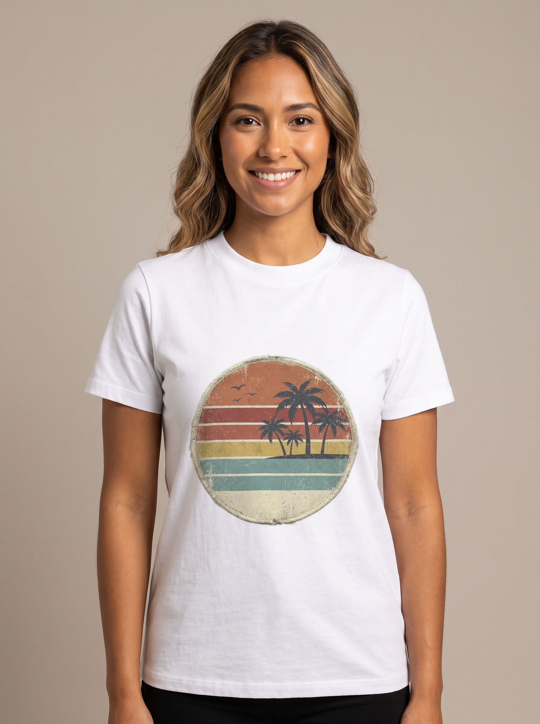 Woman wearing the Retro Sunset Circle badge tee in White, vintage circle with two palms and a striped sunset over the ocean centered on the chest