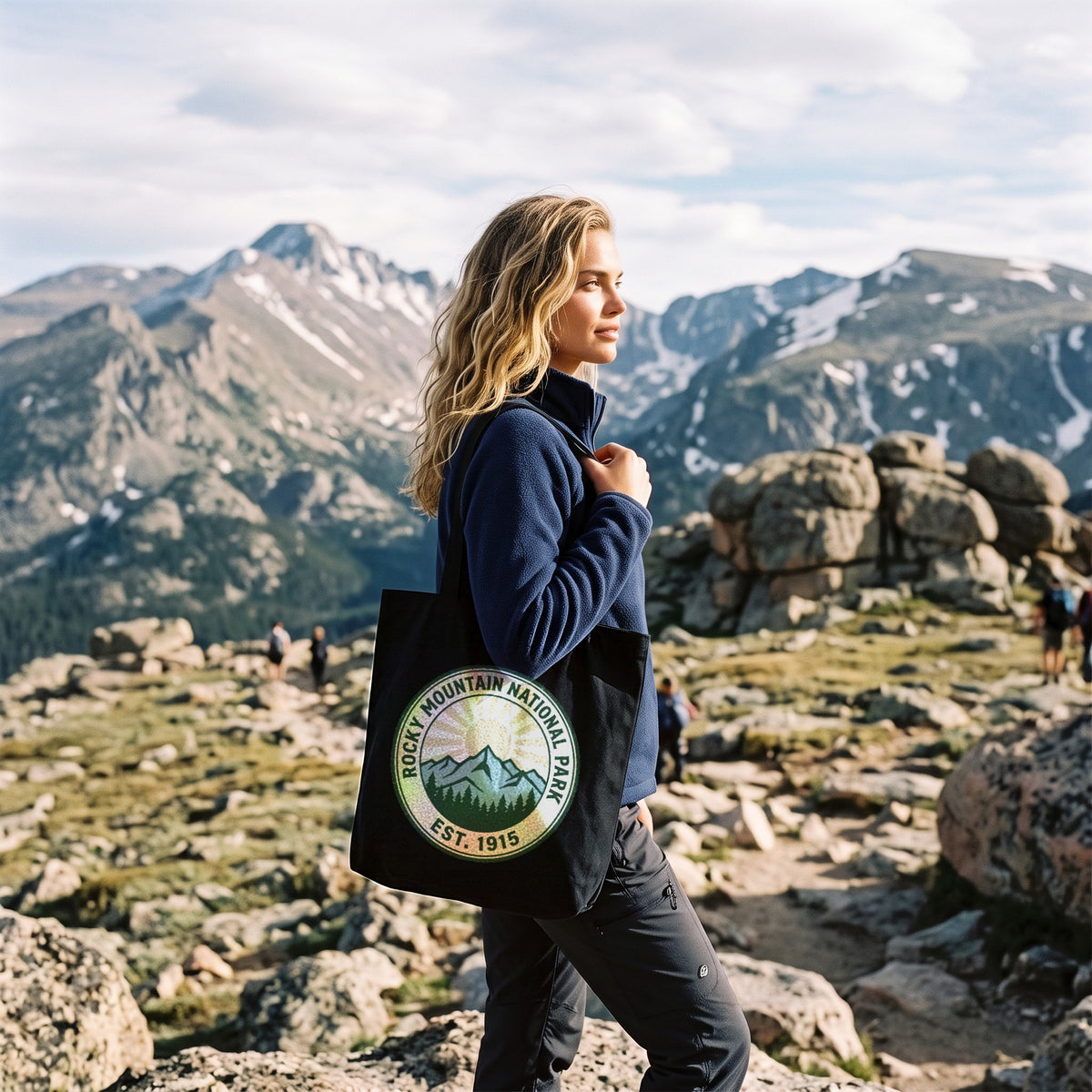 Rocky Mountain National Park Canvas Tote Bag in black, worn by an approved model, wide lifestyle photograph