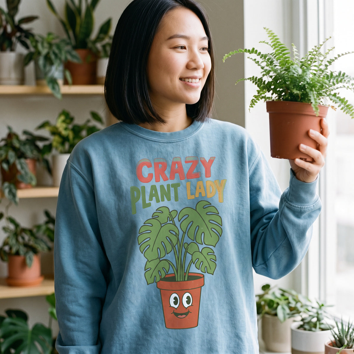 Crazy Plant Lady crewneck sweatshirt in ocean, worn by an approved model, close lifestyle photograph