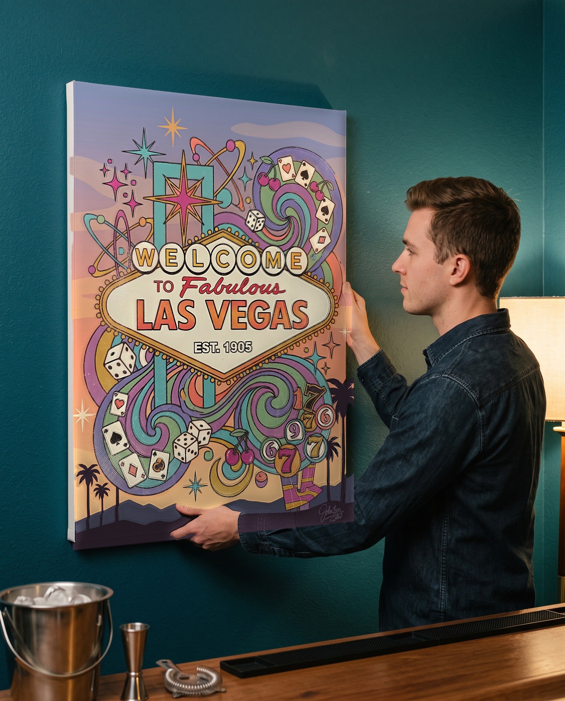 Man leveling the Las Vegas welcome sign canvas, showing its true 18 by 24 inch size