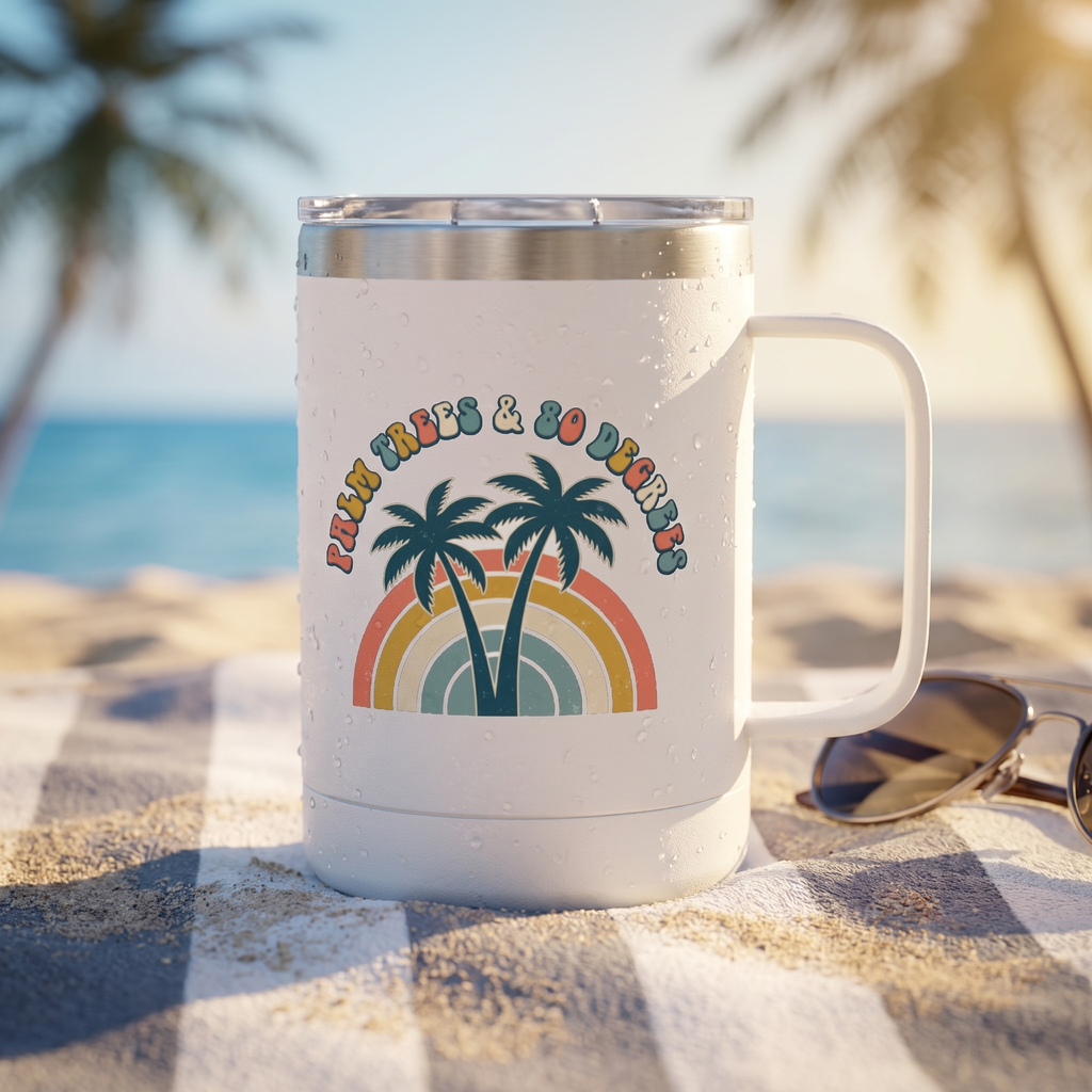Palm Trees and 80 Degrees 15oz insulated tumbler with handle on a beach towel with sunglasses and condensation, retro rainbow palms design, lifestyle photo