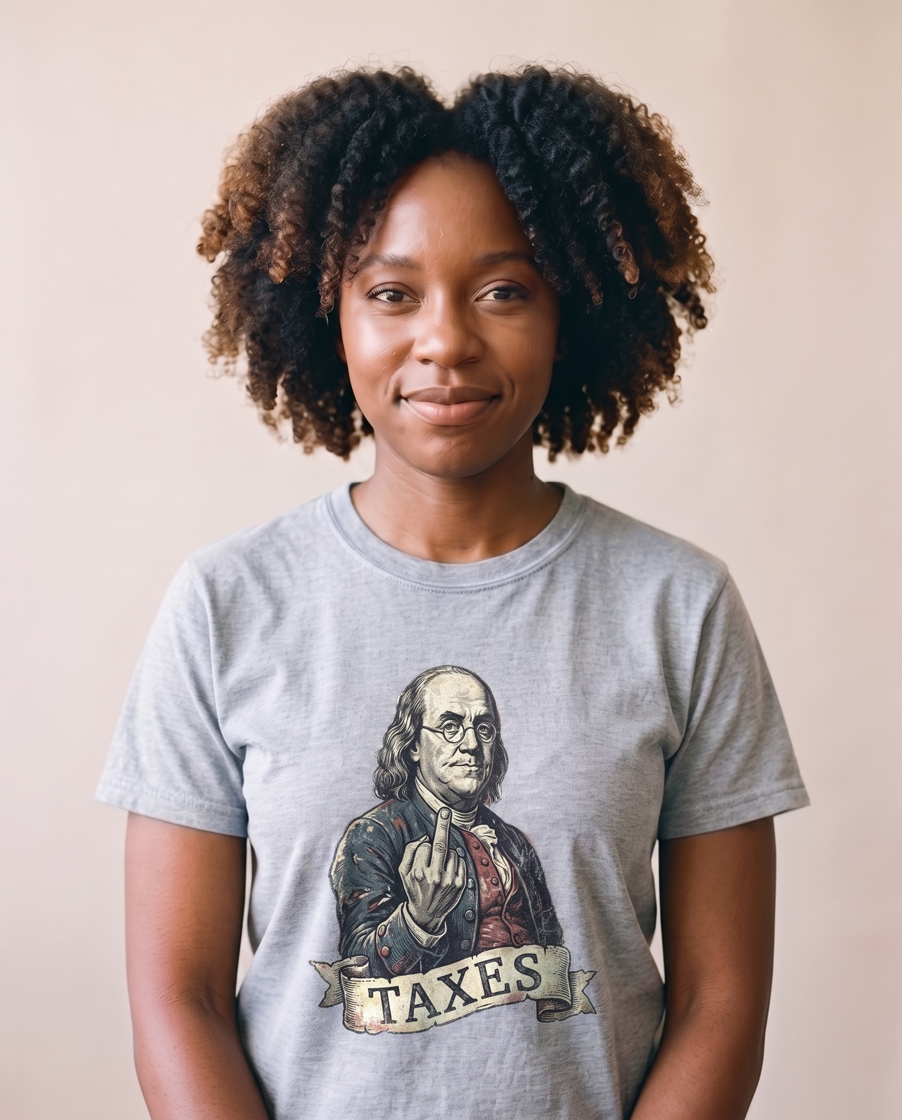 Woman wearing the Ben Franklin TAXES tee in Sport Grey, vintage engraved Franklin print centered at mid-chest, matte screen print