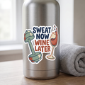 Sweat Now Wine Later kiss-cut sticker on a stainless water bottle with a gym towel, funny gym and wine sticker