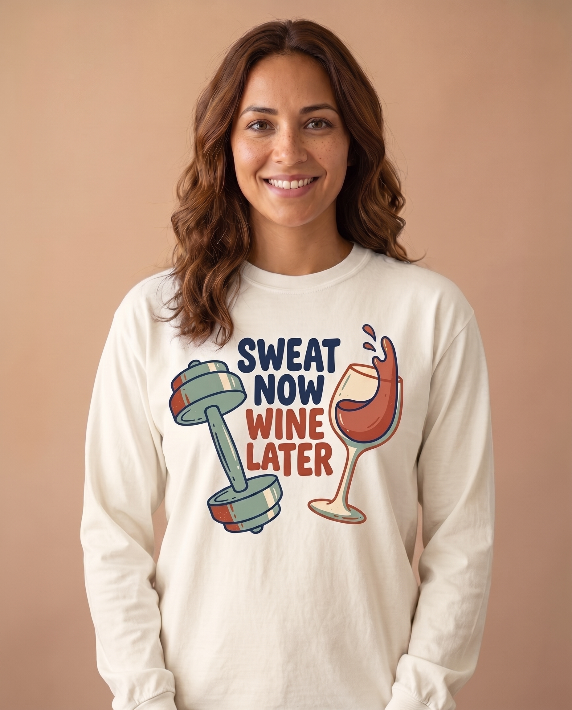 Sweat Now Wine Later long sleeve in Ivory, stacked navy and rust lettering with dumbbell and wine glass print at mid chest