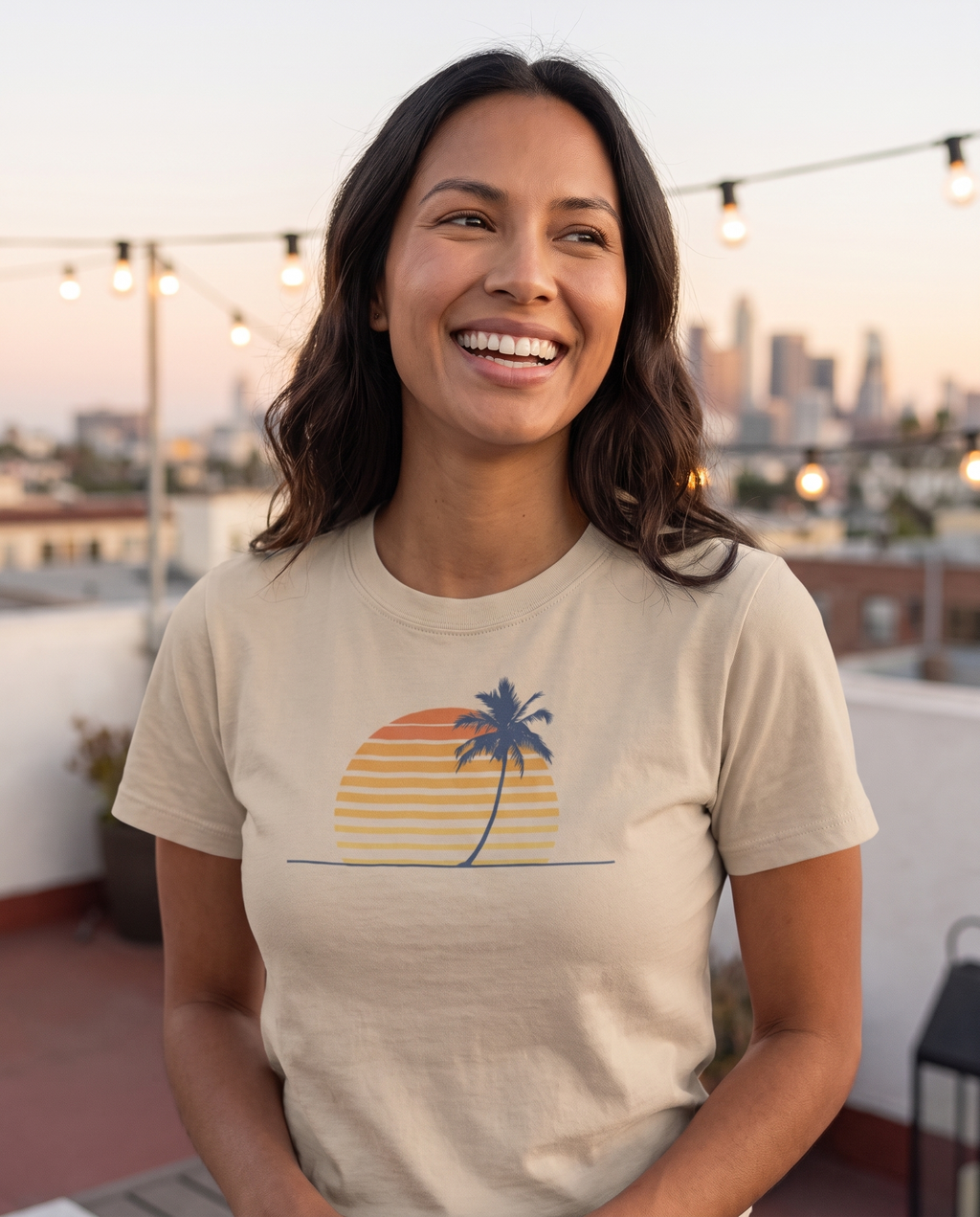 Retro palm and sunset minimalist tee in sand on a rooftop terrace at dusk