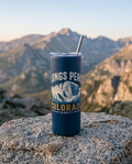 Longs Peak Colorado 20oz insulated tumbler in Navy on a summit rock
