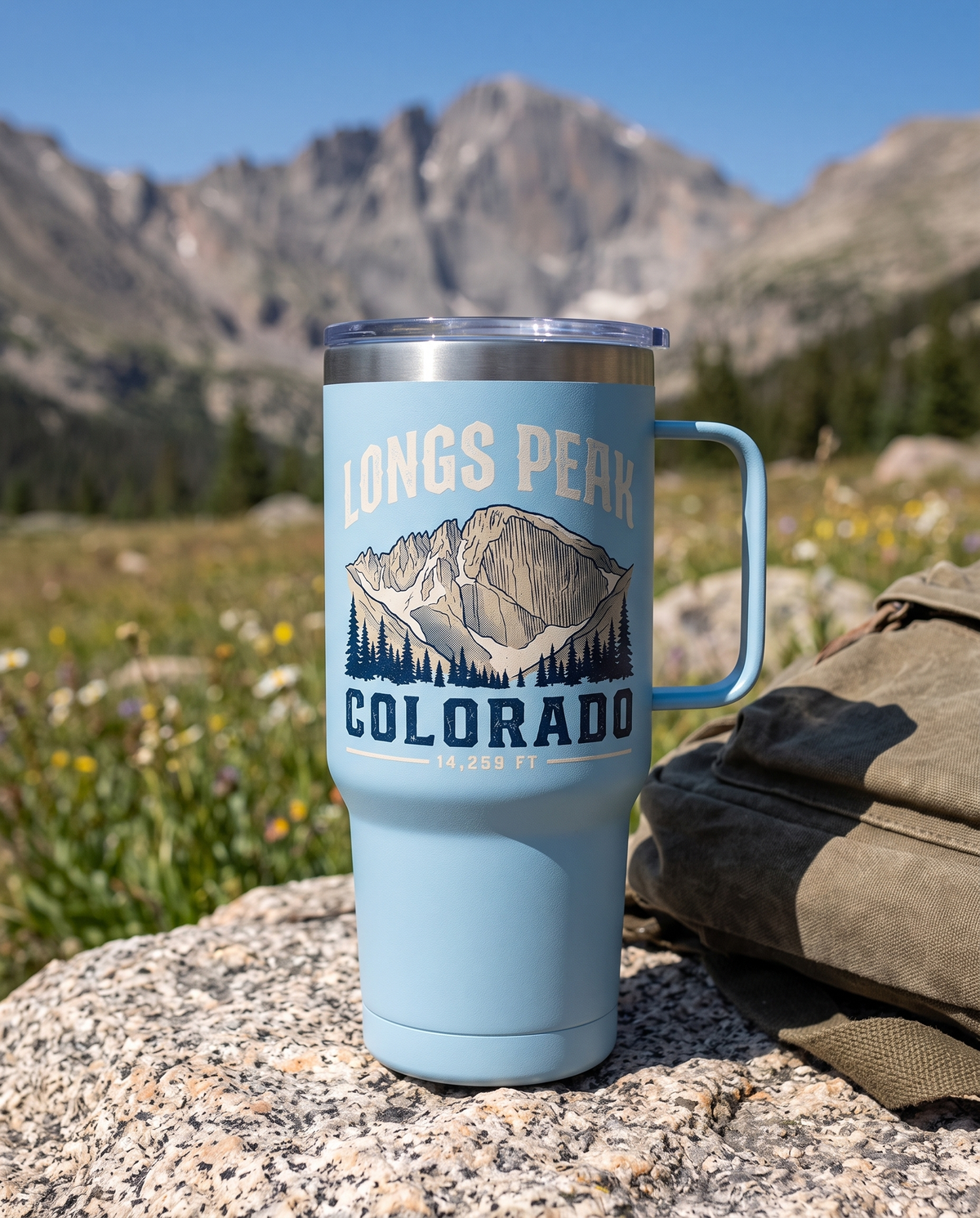 Longs Peak Colorado 15oz coffee tumbler in Light Blue on an alpine meadow rock
