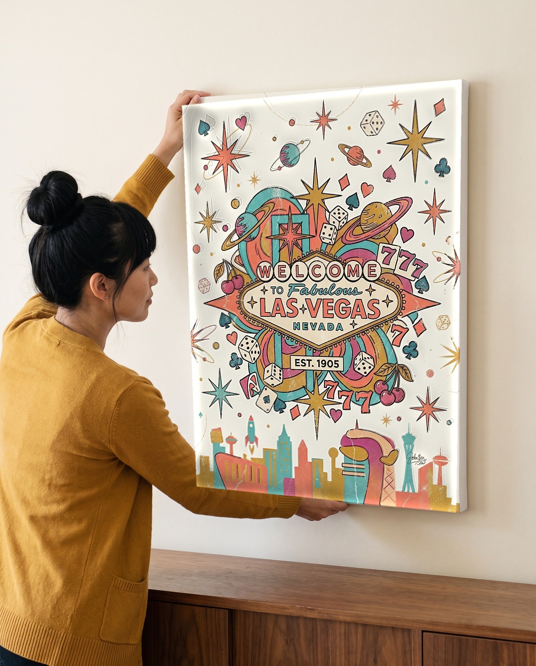 Woman leveling the retro casino canvas, showing its true 18 by 24 inch size