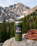 Olive green Longs Peak 20oz tumbler on granite at a Rocky Mountain trailhead