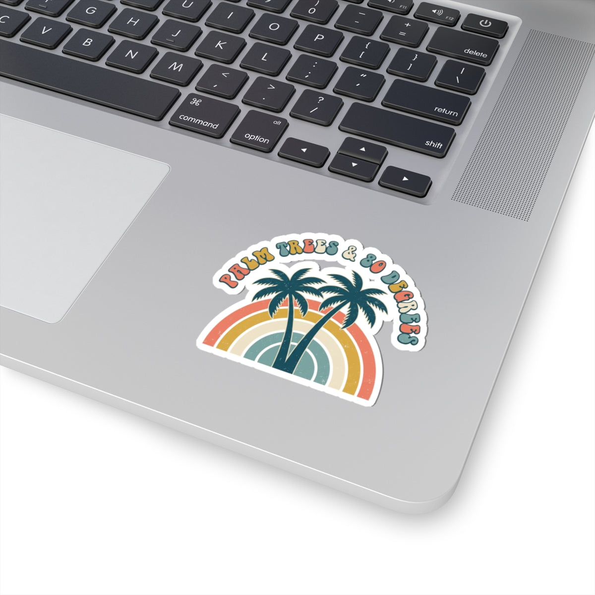 Palm Trees & 80 Degrees retro rainbow vinyl sticker shown on a laptop