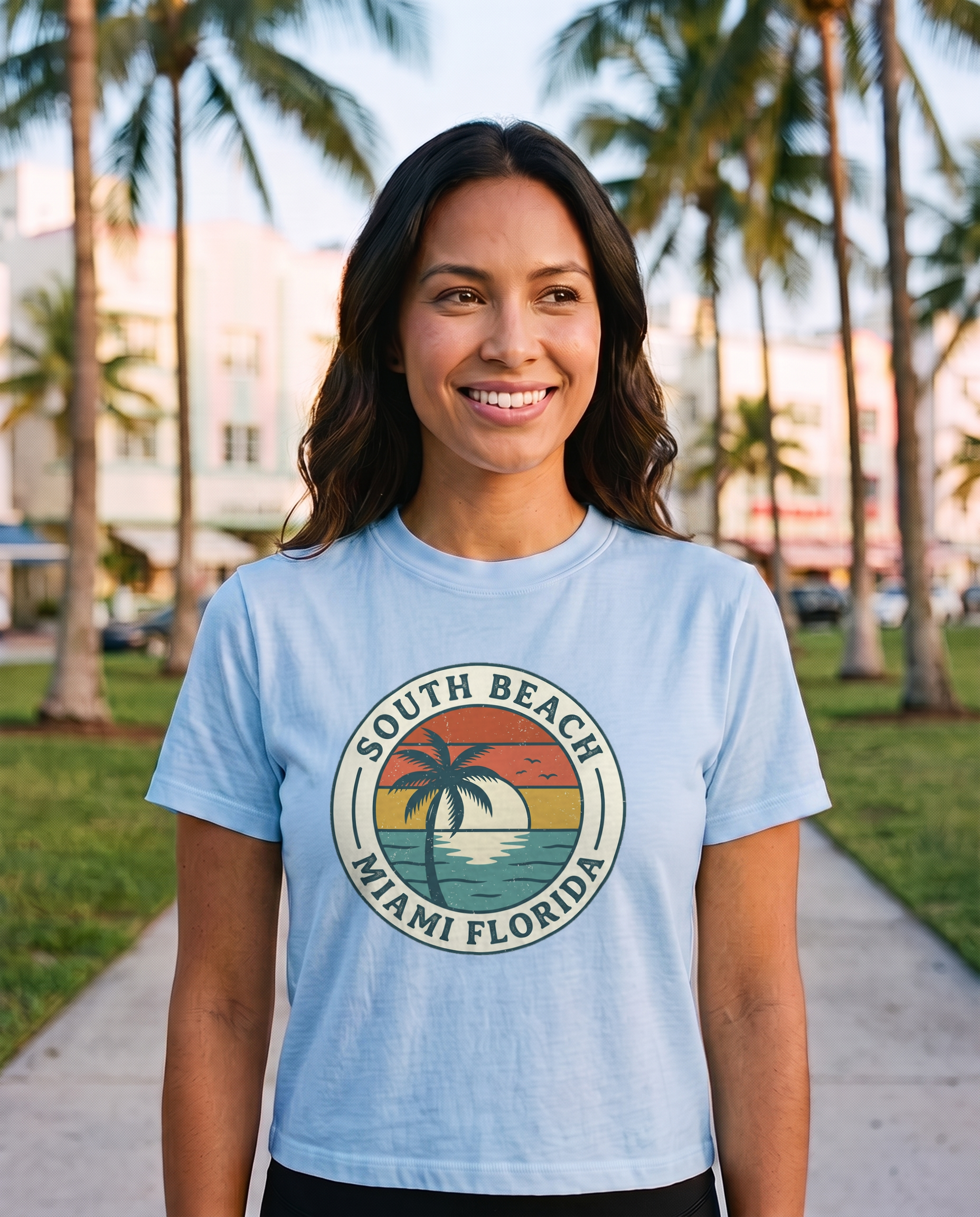 South Beach Miami retro badge tee in Carolina Blue on model, mid chest print