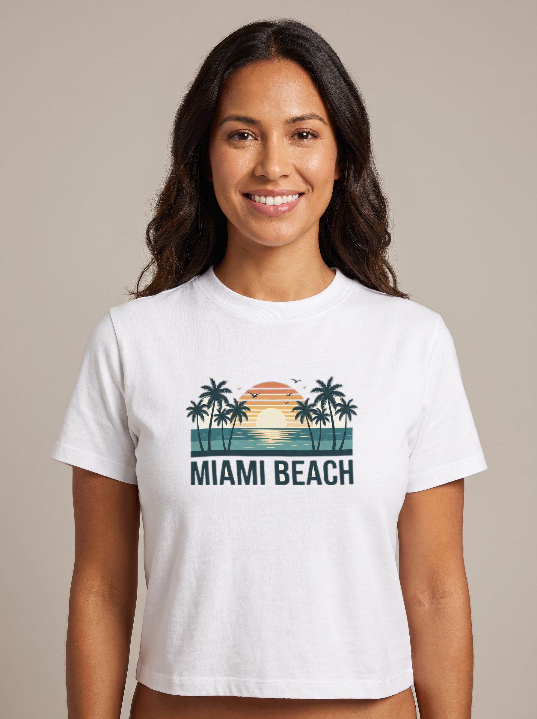 Woman wearing the Miami Beach retro tee in White, vintage palms and sunset with MIAMI BEACH lettering centered on the chest