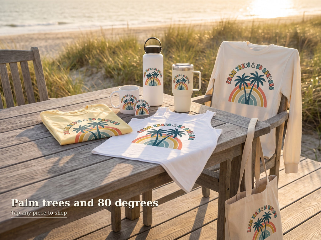 Shop the Palm Trees and 80 Degrees collection board: tee, tank, long sleeve, mug, tumblers, sticker and tote arranged on a beach porch table, tap any piece to shop